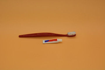 toothbrush and travel small tube of toothpaste