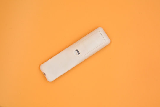 The remote control is isolated on a white background