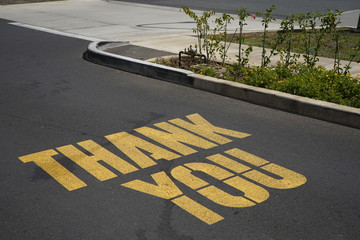 Thank you sign on the road