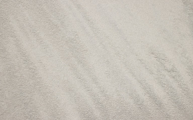 Fototapeta na wymiar White sea sand of the sea.