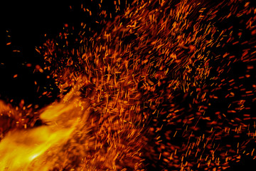 flame of fire with sparks on a black background