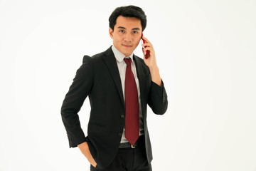 Young asian male is talking on the phone with business partner. Business concept