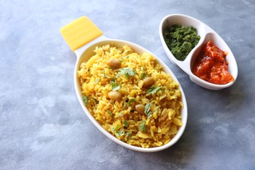 Indian comfort Food - Fresh Masala peanuts rice also known as Peanuts Pulav or rice khichdi. Garnished with coriander. Served hot with green chutney and mango pickle. with Copy space. 
