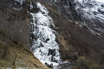 Fototapeta na wymiar Frozen Brekkefossen falls in Flam Norway 