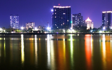 Colorful night view of Sriracha (Thailand) with modern city buildings