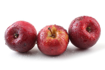 Three red little apples