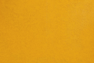 deep yellow coarse plaster wall
