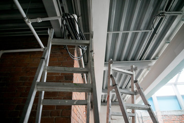 Obraz premium repair in the apartment, a staircase with a building tool