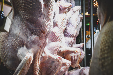 Turkeys hanging on sale before Christmas in a Mexican market.