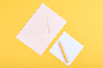 Pencil and letter with envelope.