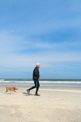 Senior man running at the beach