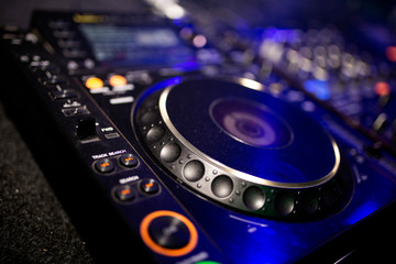 Fototapeta na wymiar dj mixing table in disco at night