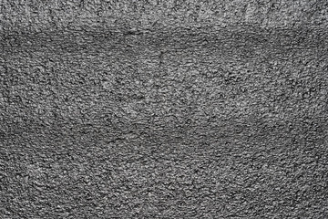 Black abstract polystyrene foam background texture. Close-up detail view of styrofoam pattern, plastic sheet, polystyrene abstract synthetic packaging material.