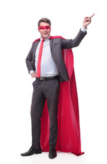 Obraz na płótnie Canvas smiling superhero businessman pointing to copy space