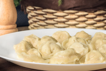 Fototapeta na wymiar Homemade dumplings - Russian dumplings. Meat dumplings, ravioli. Dumplings with stuffing.