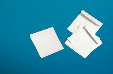 White envelope and post card on background. Top view blank envelope mockup and blank letterhead...