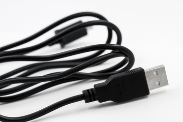 Black adapter USB to micro USB type c data and power cable on white background. Closeup