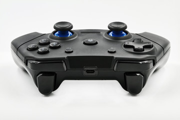 Gamepad on a white background. Game Joystick. Closeup, selective focus