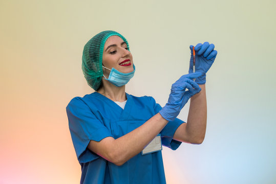 Attractive Nurse With Syringe Getting Ready For Injection. Medical Theme