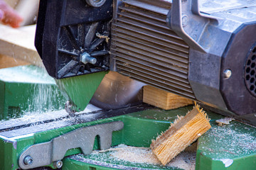 Circular saw cutting a wood for different products
