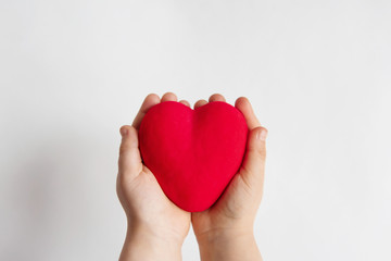 Fototapeta premium Child hands holding red heart, health care, donate and family insurance concept, world heart day, world health day, family love concept.
