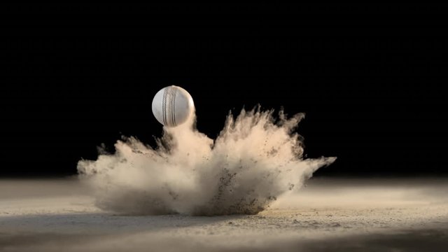White Cricket ball bouncing and creating dust in ultra slow motion. Alpha matte included