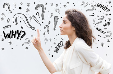 Beautiful serious woman pointing up with finger. Side view of focused curly lady threatening with finger. Threat concept