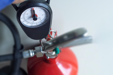 Carbon dioxide or CO2 fire extinguisher is a tank that needs to be checked by weighing only