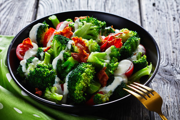 broccoli tomato bacon salad in a bowl