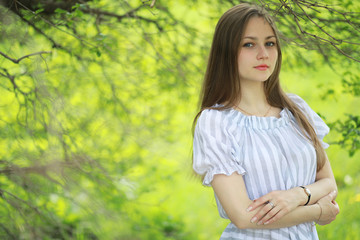 Fototapeta premium A girl in a spring green park
