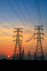 High voltage power tower and beautiful nature landscape at sunset