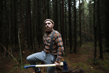 A bearded lumberjack with a large ax