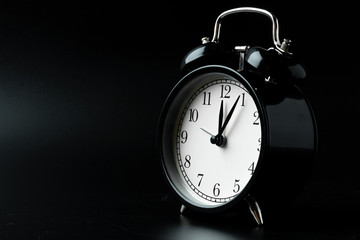 Alarm clock close up on black background