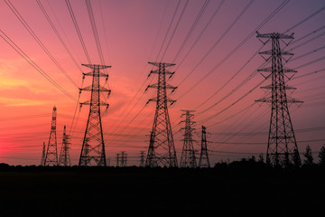 High voltage power tower and beautiful nature landscape at sunset