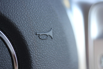Horn symbol on steering wheel