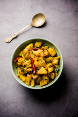 Kaccha Papita Sabji or Raw Papaya Sabzi, served in a karahi or bowl. selective focus