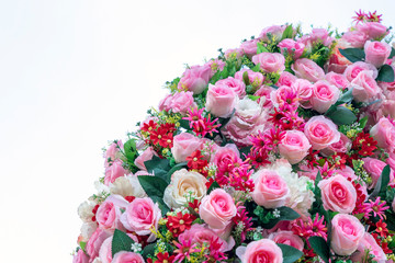 Artificial roses on a white background.