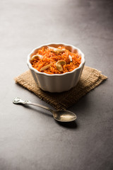 Vermicelli  / Semiya Kesari is a popular indian sweet served in a bowl, garnished with dry fruits like cashew and almond, made in pure ghee