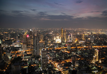 panoramic skyline of Bangkok by night from King Power Mahanakhon, Bangkok, Thailand