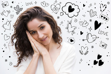 Smiling young woman showing sleep gesture. Serene attractive lady looking at camera. Sleeping concept