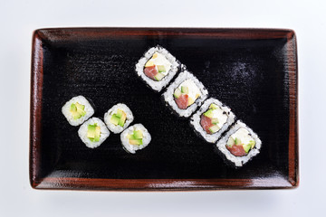 sushi rolls in a plate on a light background set