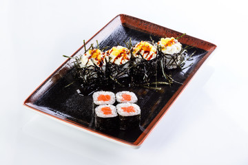 sushi rolls in a plate on a light background set