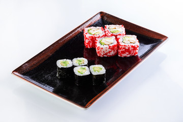 sushi rolls in a plate on a light background set