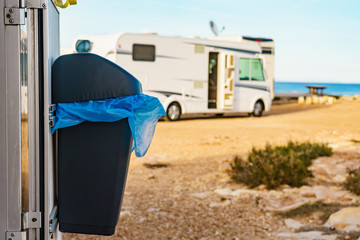 Camper with trash can.