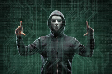 Anonymous computer hacker over abstract digital background. Obscured dark face in mask and hood. Data thief, internet attack, darknet fraud, dangerous viruses and cyber security.