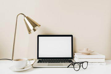 Blank screen laptop. Home office desk table workspace. Copy space mockup template.