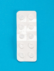 Pill strip on blue on background