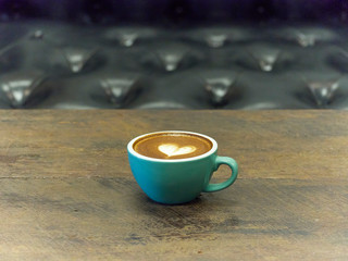 Coffee cup latte art in cafe.