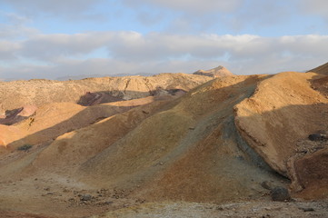 Desert landscape at sunrise. Hiking desert part of Israel National Trail. Negev desert . Valley. Colorful sands 