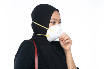 A young woman was strangled and wearing a mask to prevent Coronavirus infection with a white...